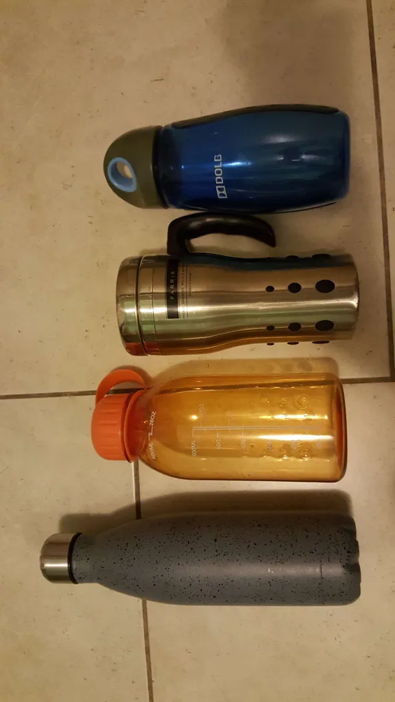 various water bottles & travel coffee mugs -- all either bran... photo 1