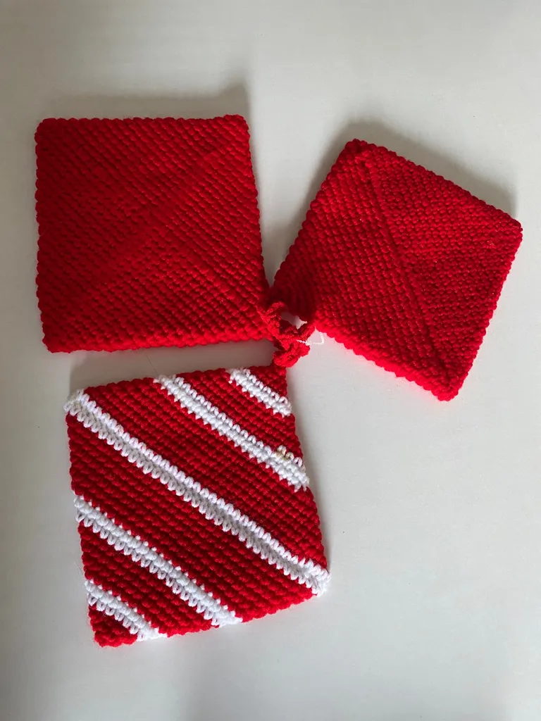 Red and white placemats or potholders, or a knit knitted coas... photo 1
