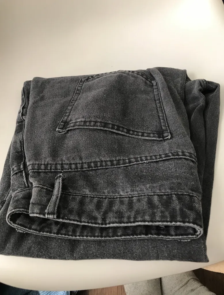 black ripped jeans photo 1