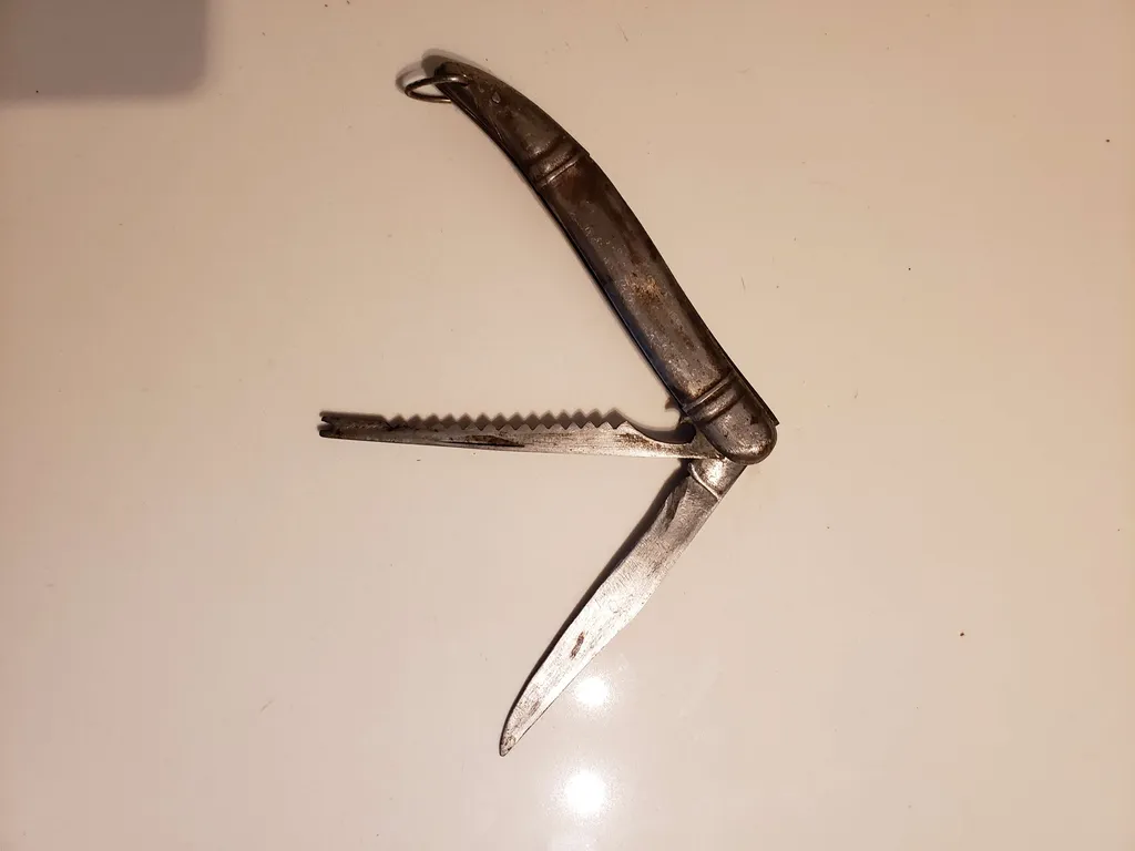 Antique fishing knife, all metal photo 1