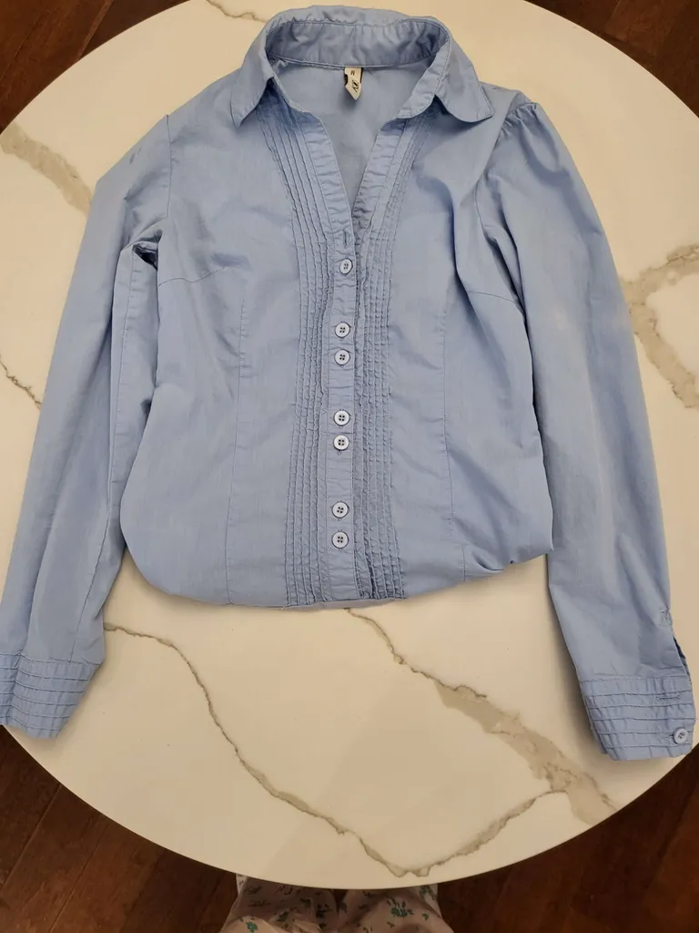 Blue shirt - it has a bottom closure photo 1