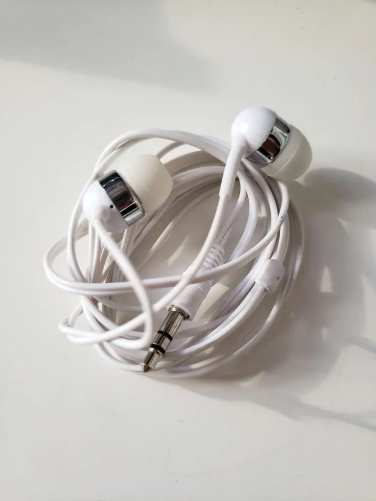 white headphones -- simple wired audio ear phones (I switched... photo 1