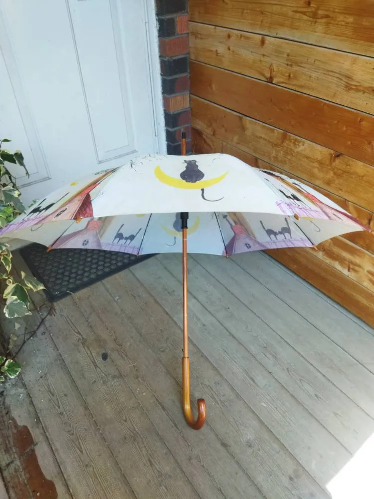Cat-themed umbrella photo 1
