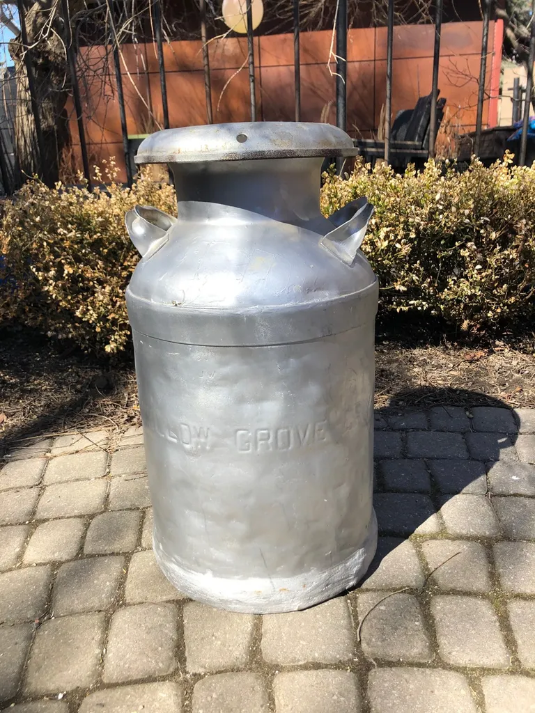 vintage 1920s 24 inch high metal milk jug photo 1