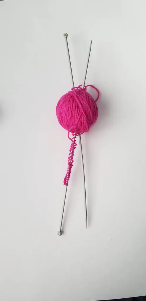 Knitting Needles + Hot Pink Yarn photo 1