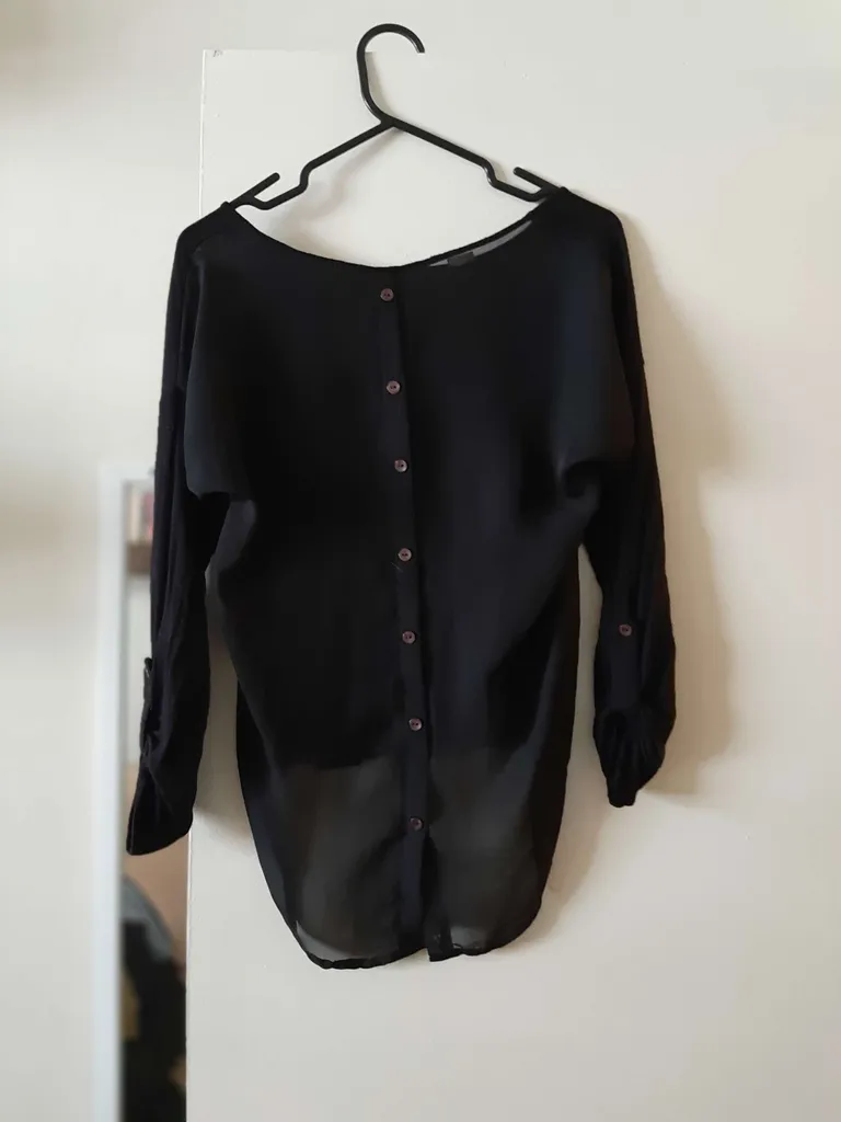 Sheer-backed black blouse photo 1