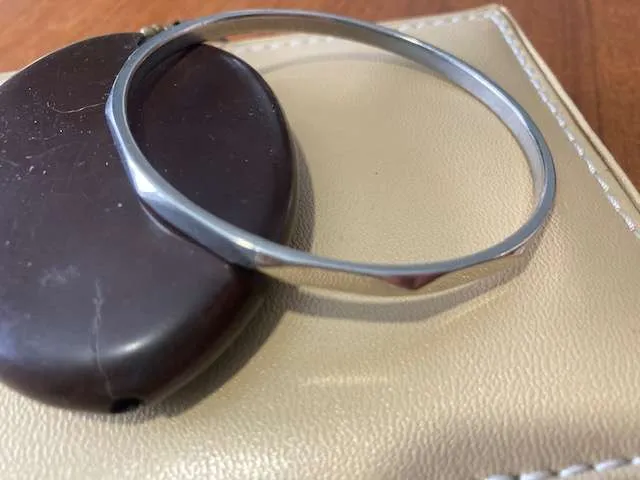 Silver tone metal bangle photo 1