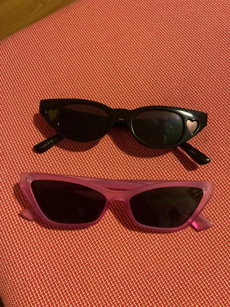 two pairs sunglasses photo 1