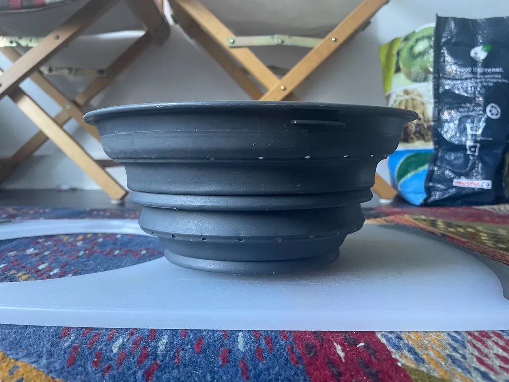 Cutting board w/ built-in strainer photo 1