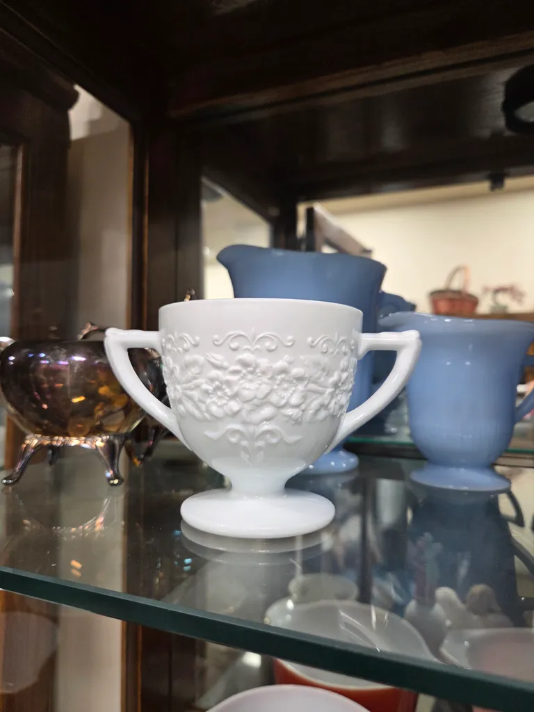 Milk glass with flowers photo 1