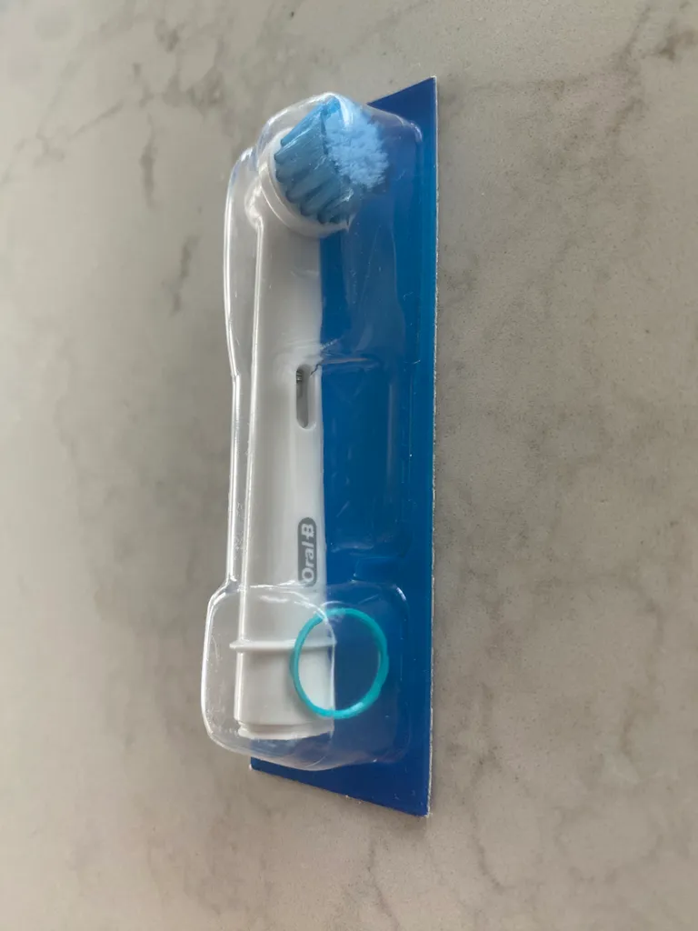New, sealed Oral B toothbrush head photo 1