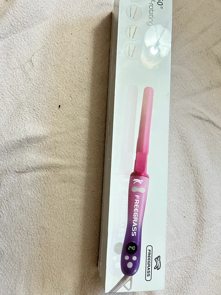 new self rotating curling iron  photo 1