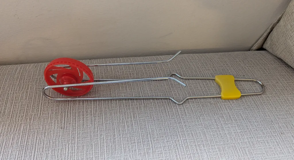 Vintage Red Plastic Wheel Toy  photo 1