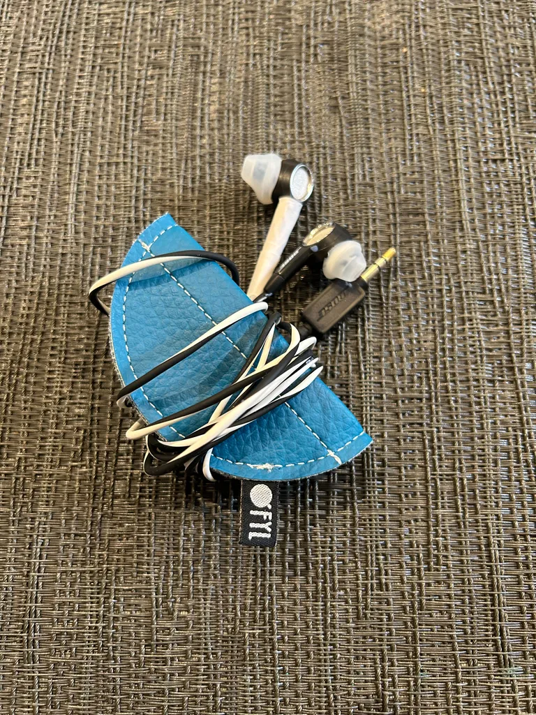 Teal leather headphone storage photo 1
