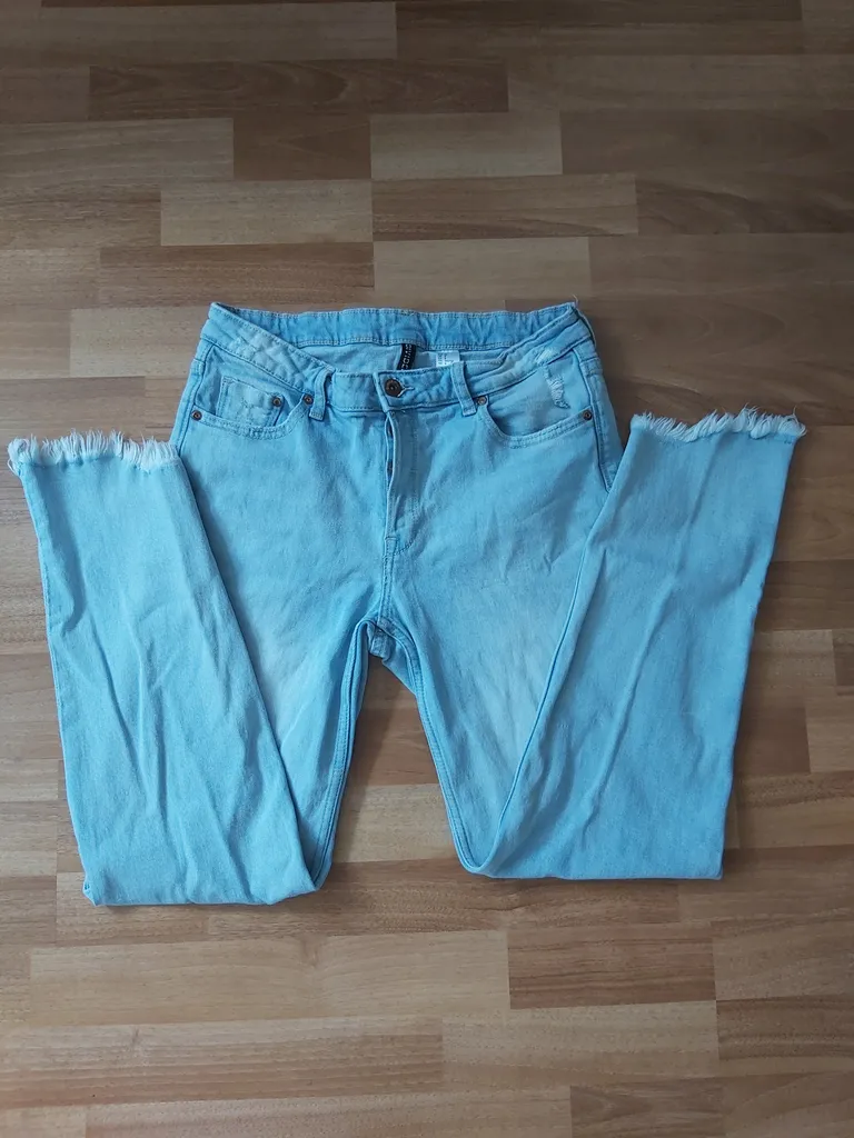 Light slightly distressed jeans photo 1