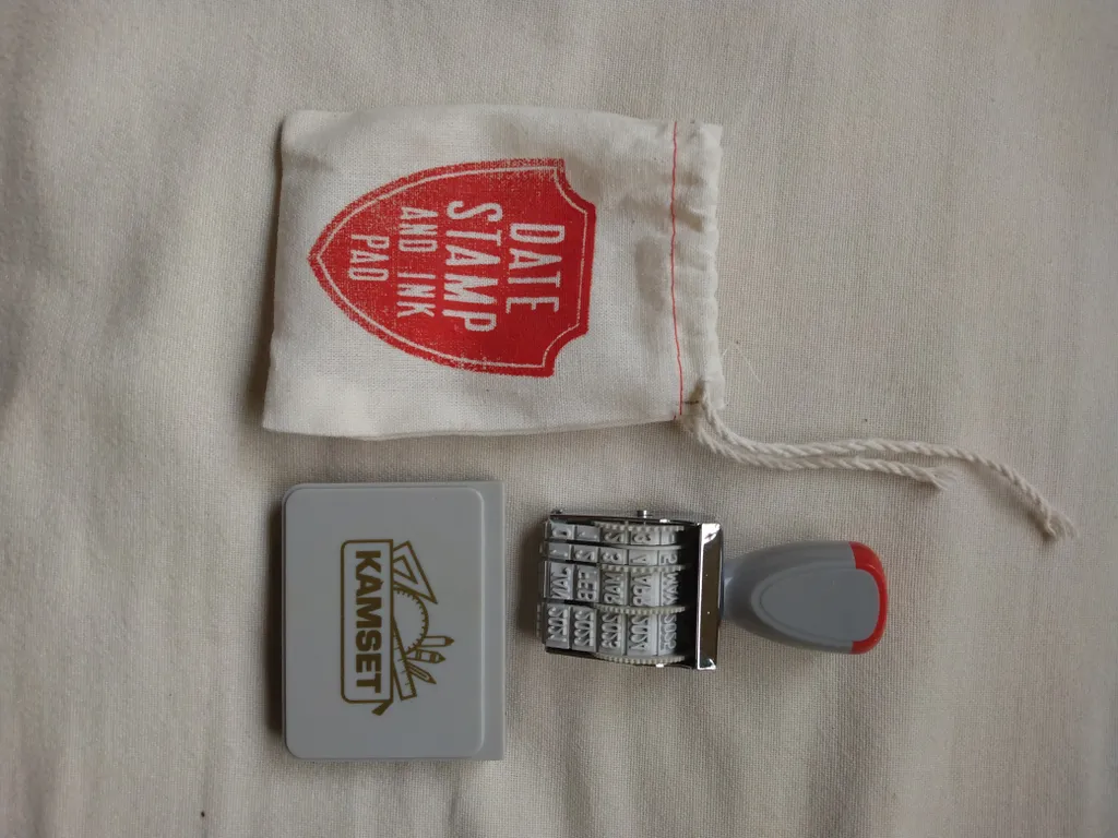 New date stamp and ink pad and pouch photo 1