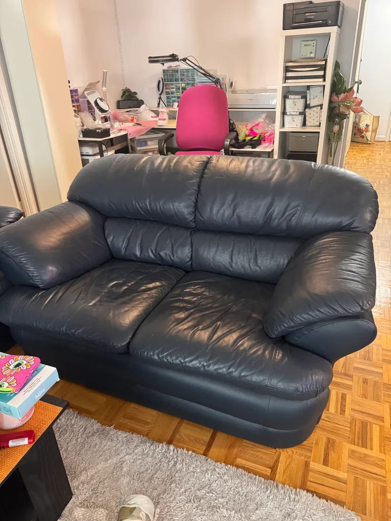 Dark blue leather love seat photo 1
