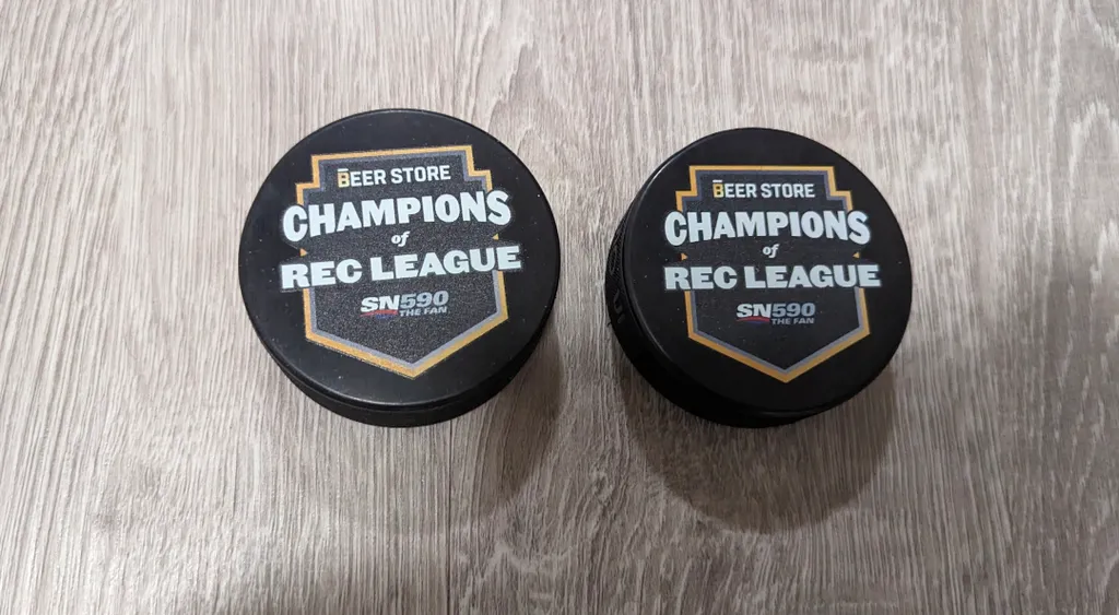 Brand New Hockey Pucks - Beer Store Champions of Rec League photo 1