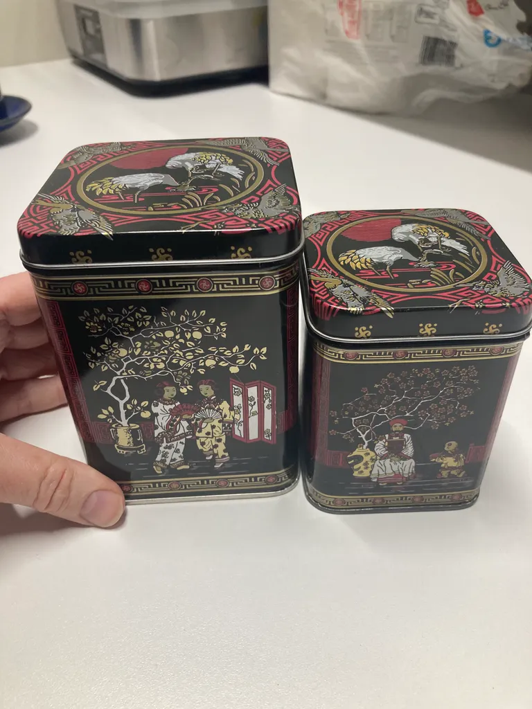 Two Nested Asian Tea Tins photo 1