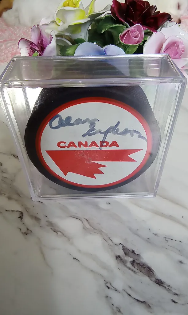 Vintage Autographed Puck 
 photo 1