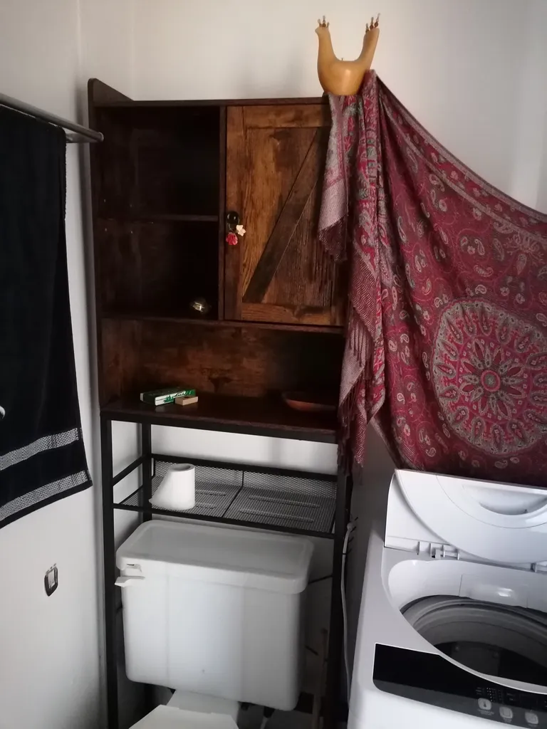 Over the toilet storage shelf photo 1