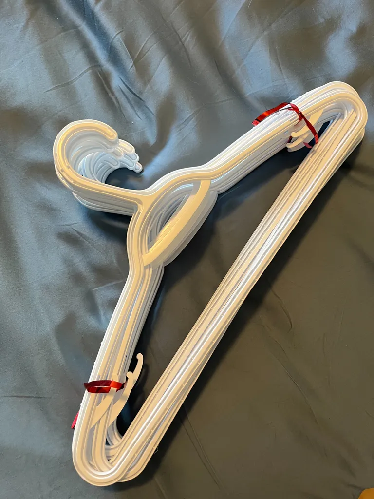 White plastic hangers  photo 1