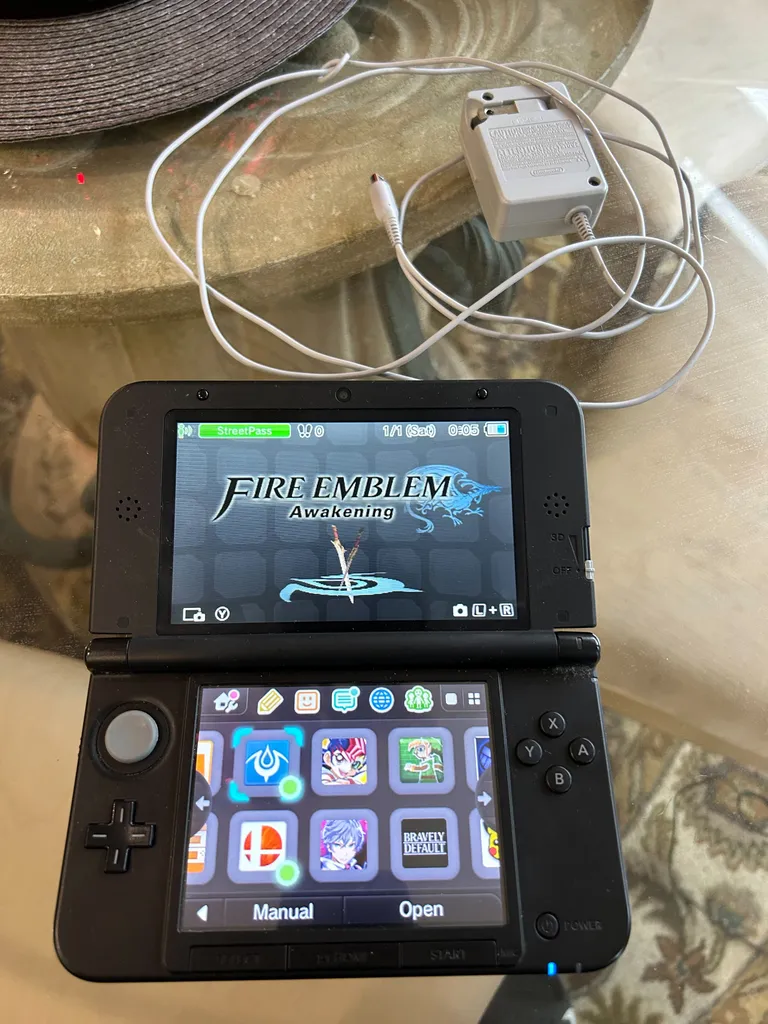 3DS XL -Black with Games + Charger photo 1