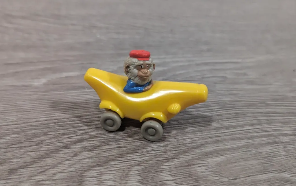 Vintage Monkey in Banana Car Toy photo 1