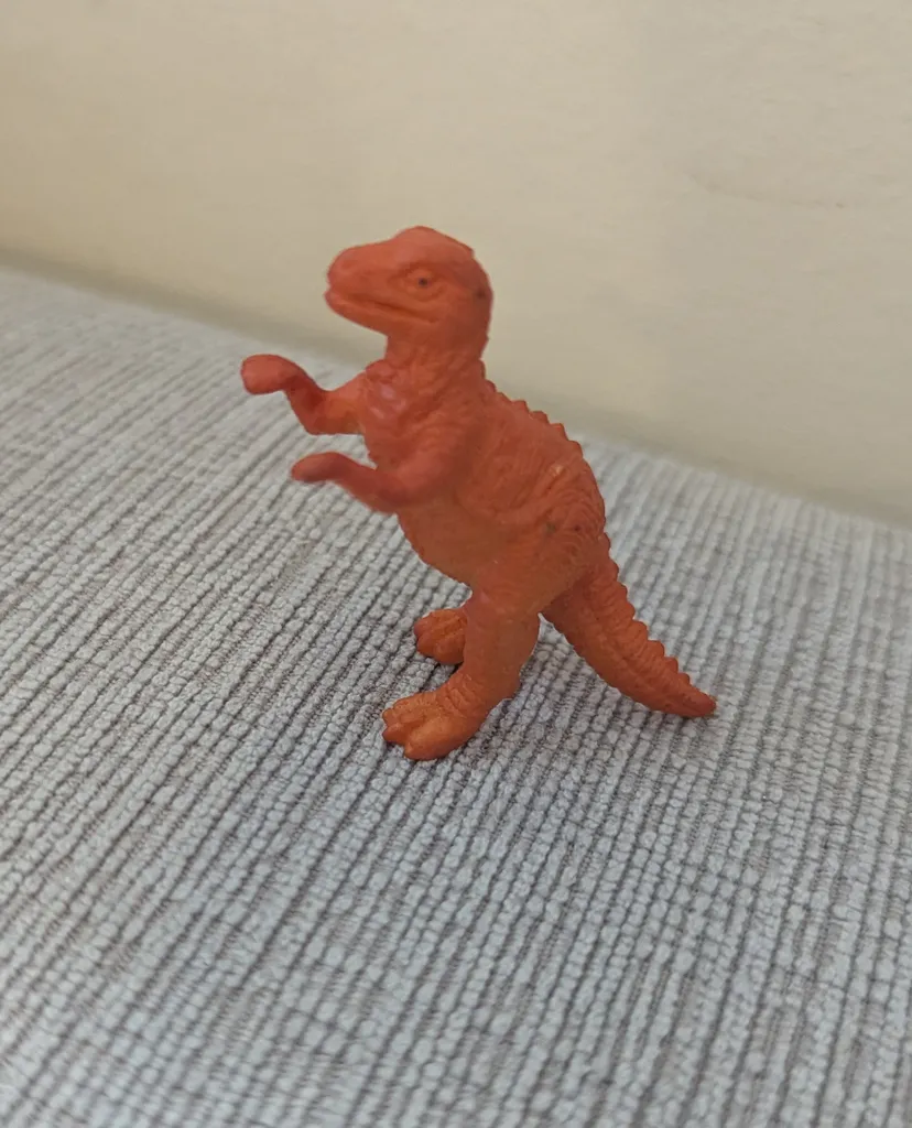 Orange Dinosaur Toy Figure photo 1