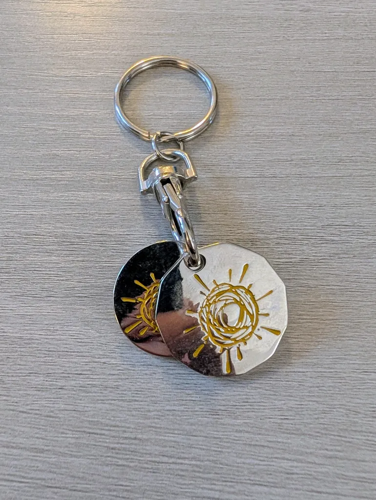Brand New Silver Keychain with Sun Design photo 1
