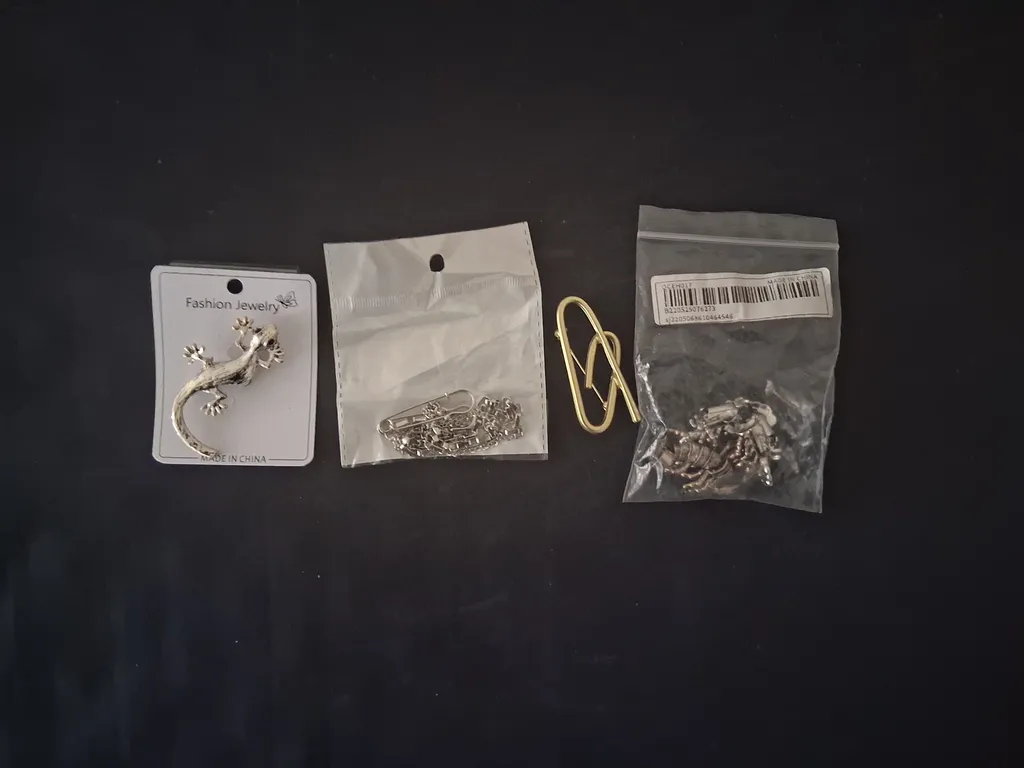 Assorted pins and clips photo 1