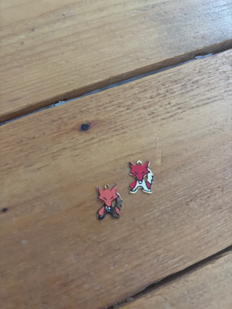 Duo of Golden Fox Enamel Charms photo 1