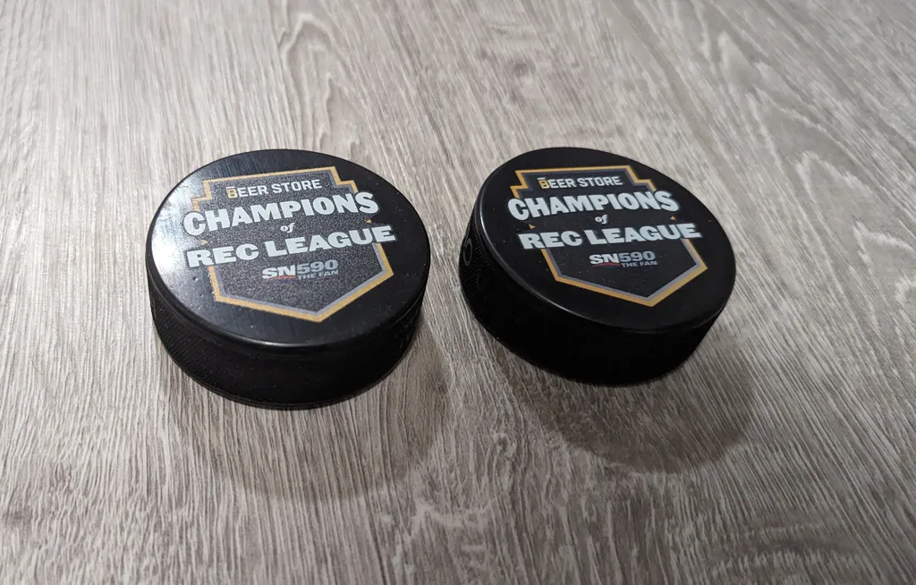 Two Brand New Hockey Pucks  photo 1