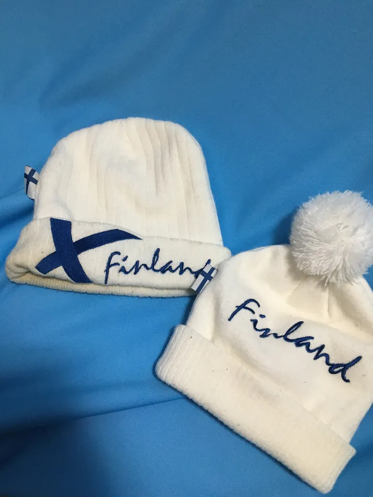 Two white Finland winter hats photo 1
