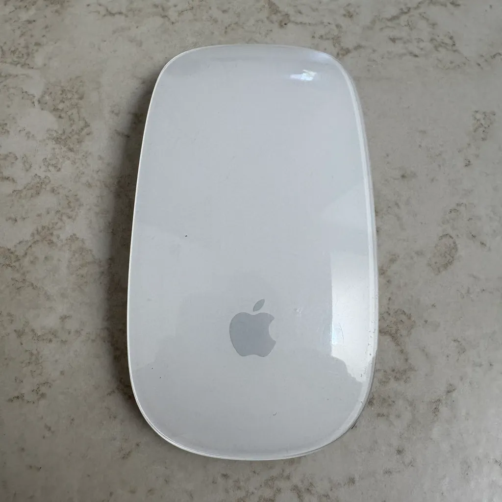 Apple Magic Mouse computer laptop tool photo 1