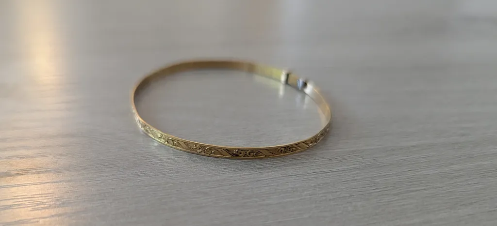 Gold Tone Bangle Bracelet photo 1