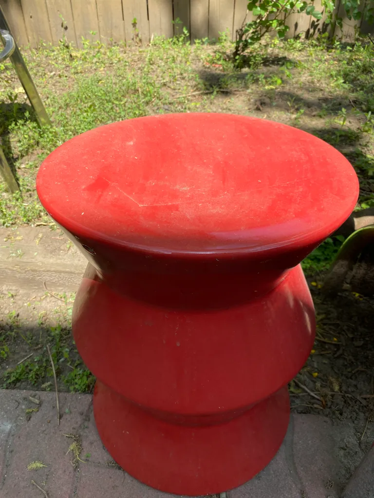 Orange kinda pottery table for plants I guess photo 1