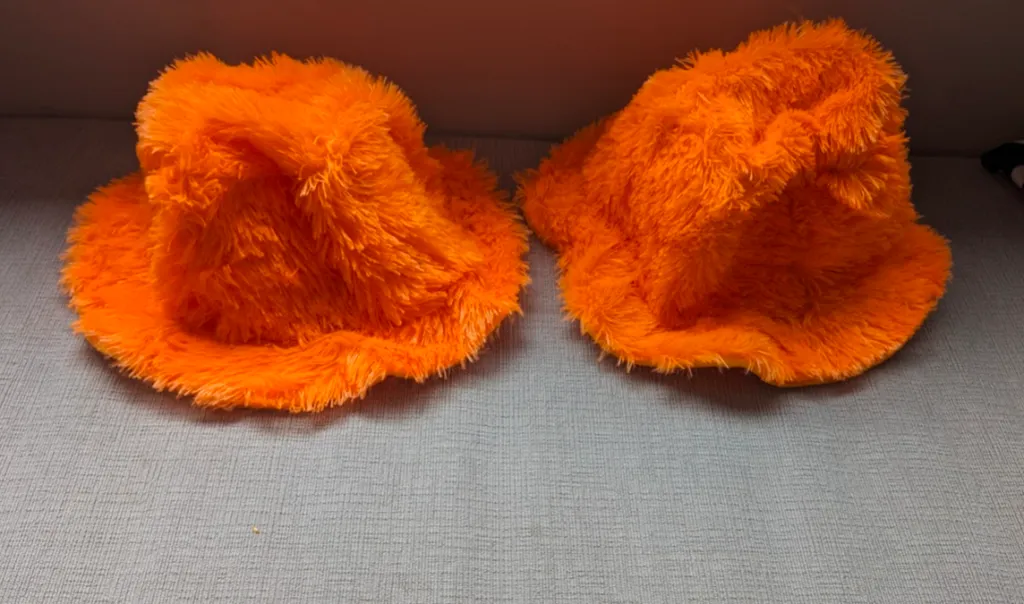 Two Orange Fuzzy Hats photo 1