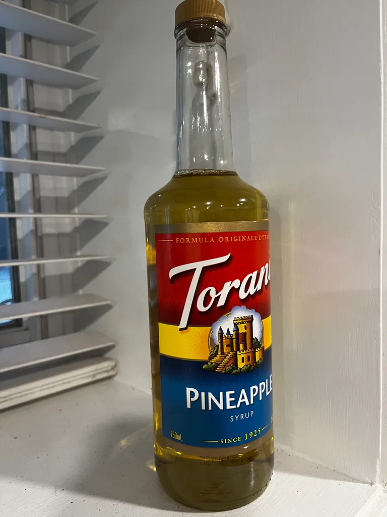 Most of a bottle of Torani Pineapple Syrup photo 1