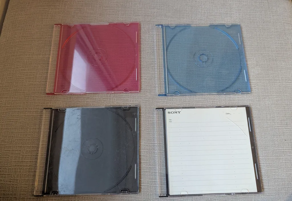 Four empty CD cases photo 1