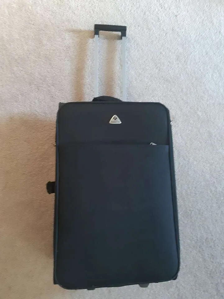 medium black suitcase photo 1