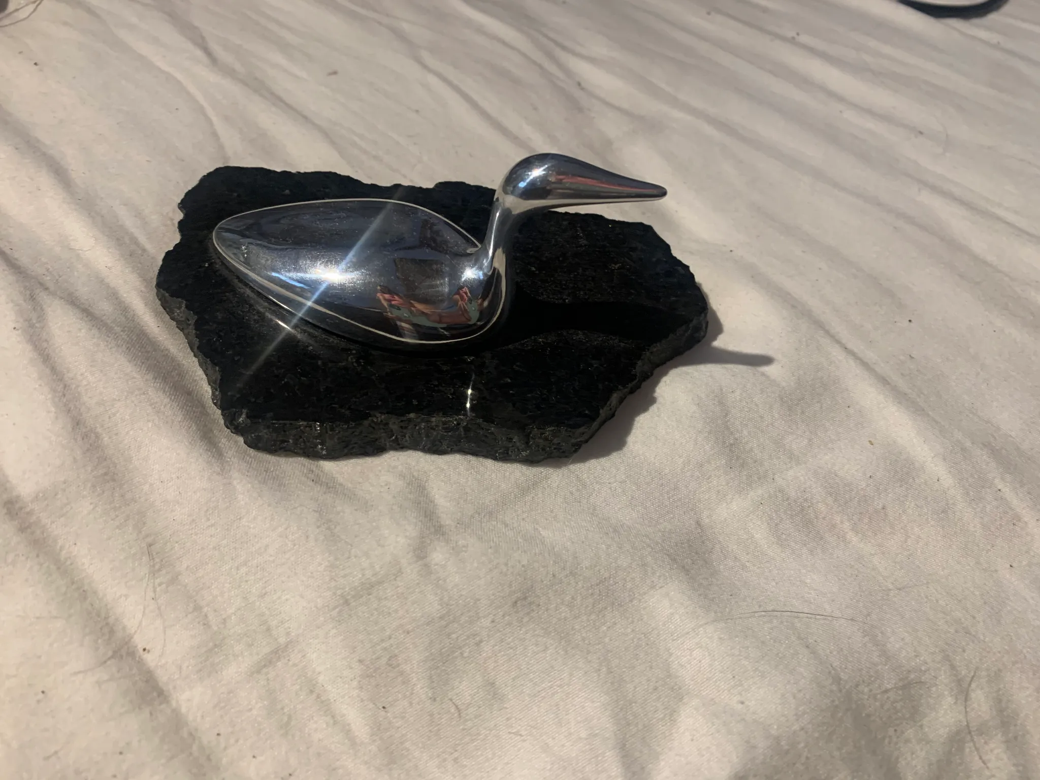 Silver loon bird and granite stone? Table decoration  photo 1