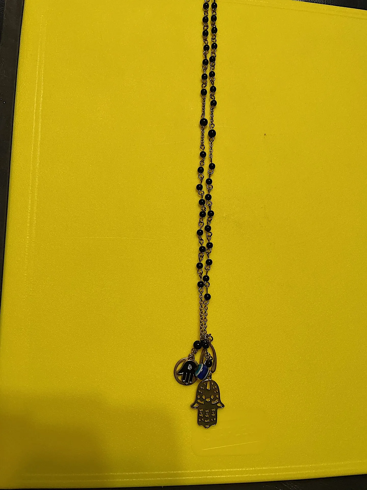 Gold (not real) Necklace with Charms: Wishbone, Eye, 2 Hamsas photo 1