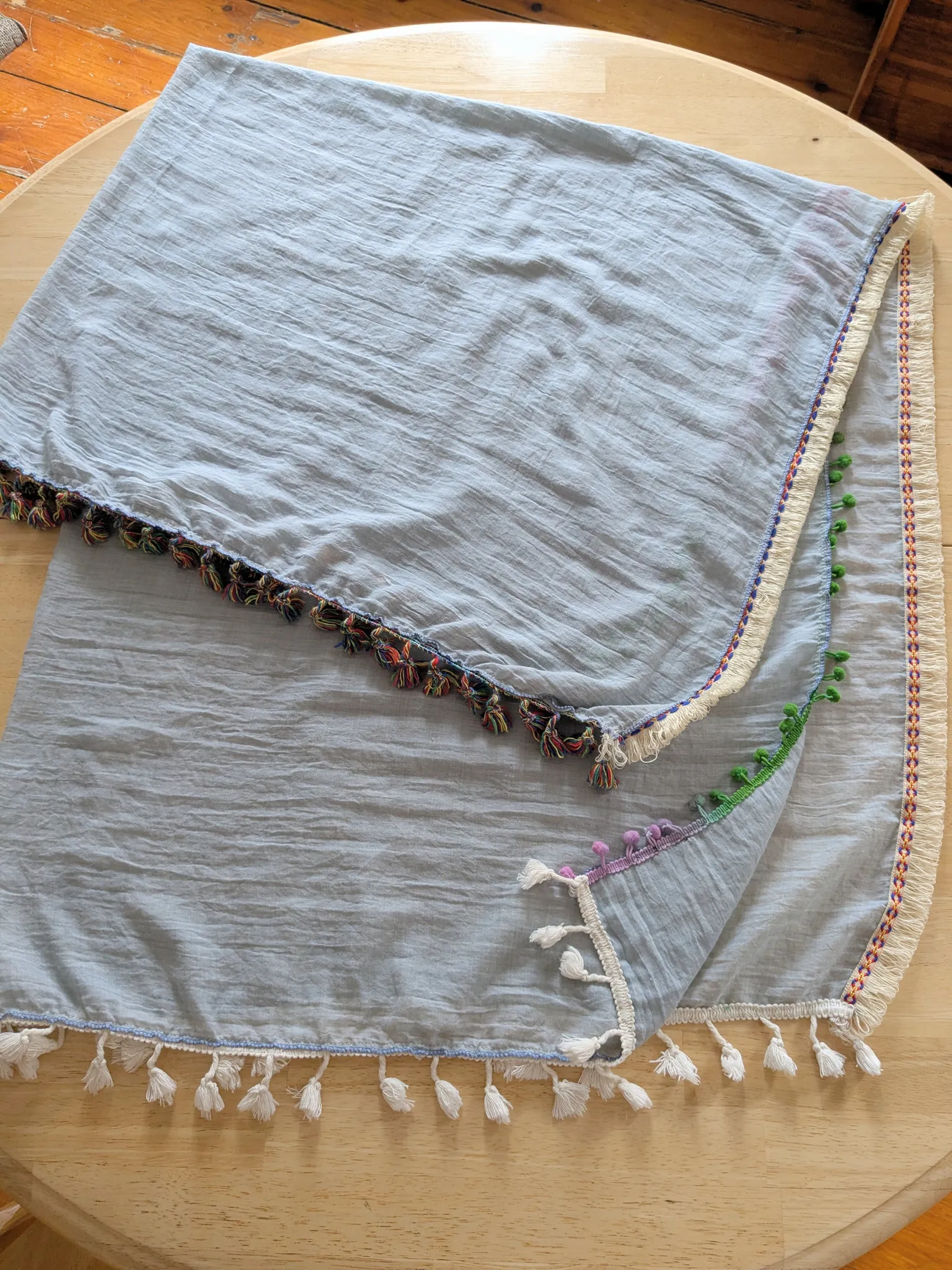 Light blueish wrap w pompons and fringe photo 1