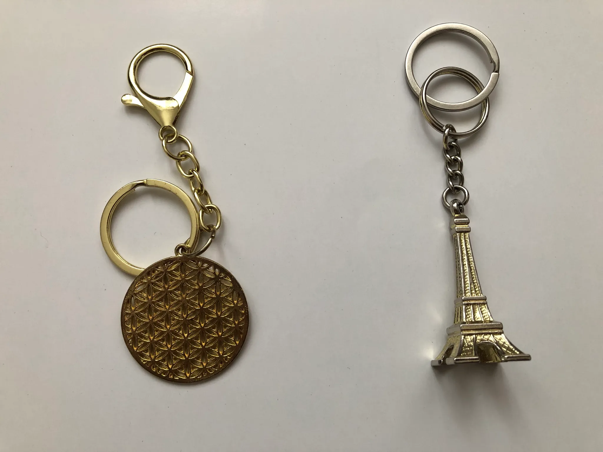 Flower of life keychain, and an Eiffel Tower keychain photo 1