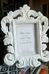Small white photo frame.  Ornate design.  Holds a small photo.   photo 2