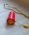 Handmade Red Cylinder Noisemaker with Lanyard photo 1