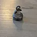 Curling Rock Zipper Charm  photo 1