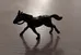 Black plastic toy horse photo 1