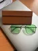 Green see-thru light tint sunglasses silver frame photo 1